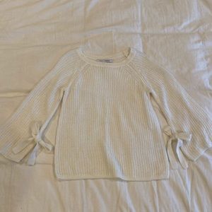 Sweater with bow tie detail on sleeves
